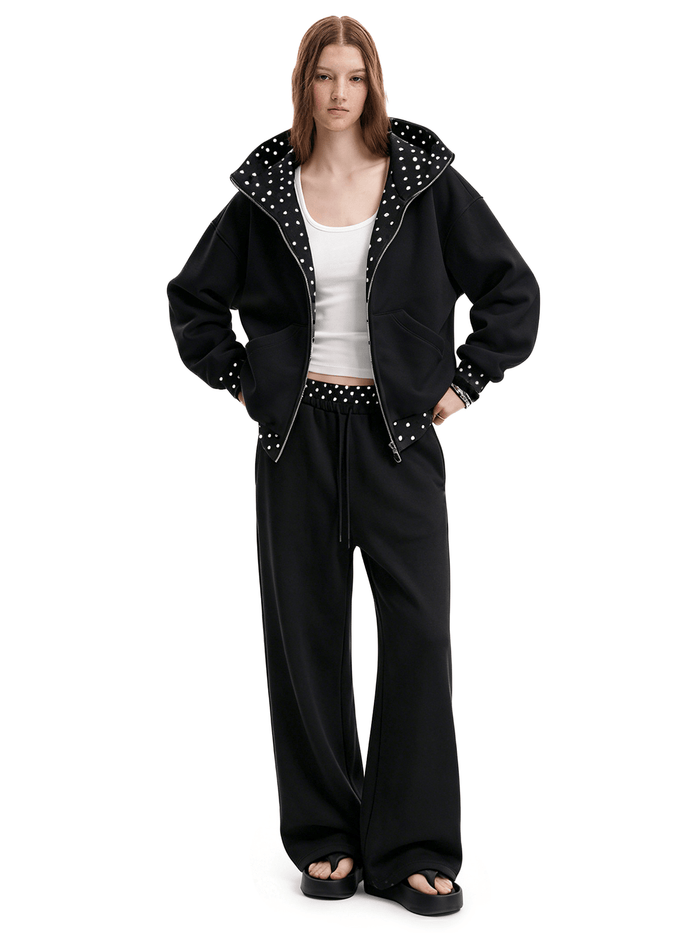 Black hoodie and matching sweats on model