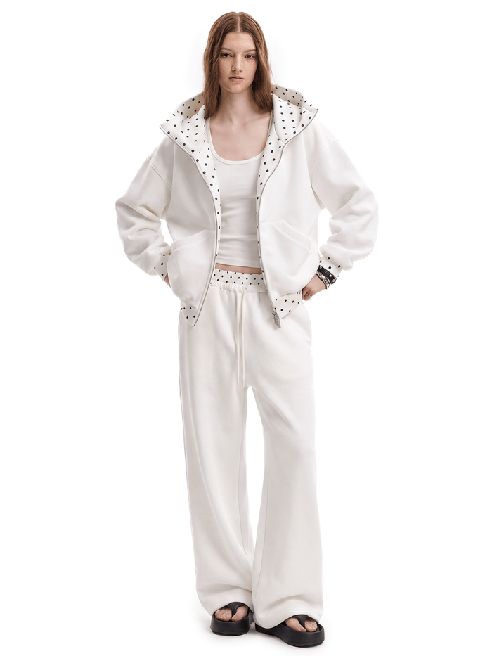 White hoodie and matching sweats on model