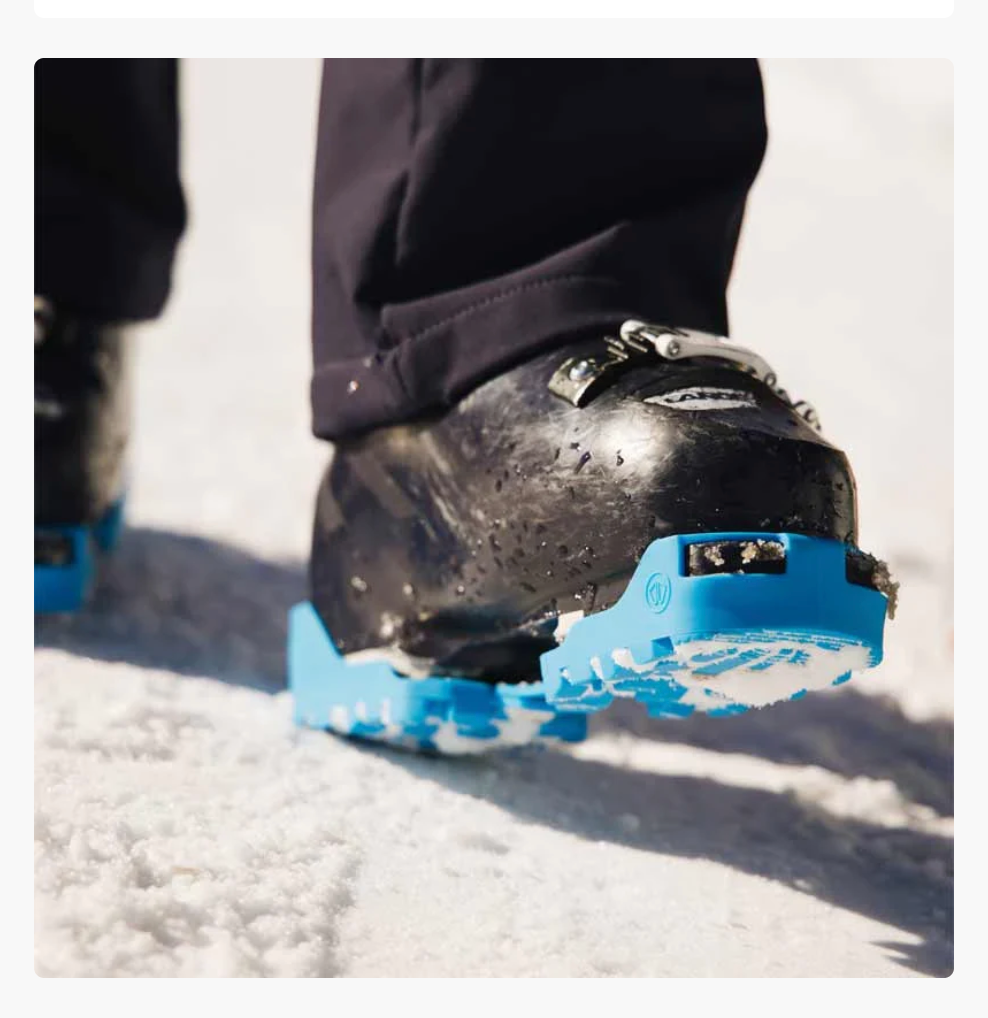 Ski boot protectors fitted to a boot on snow